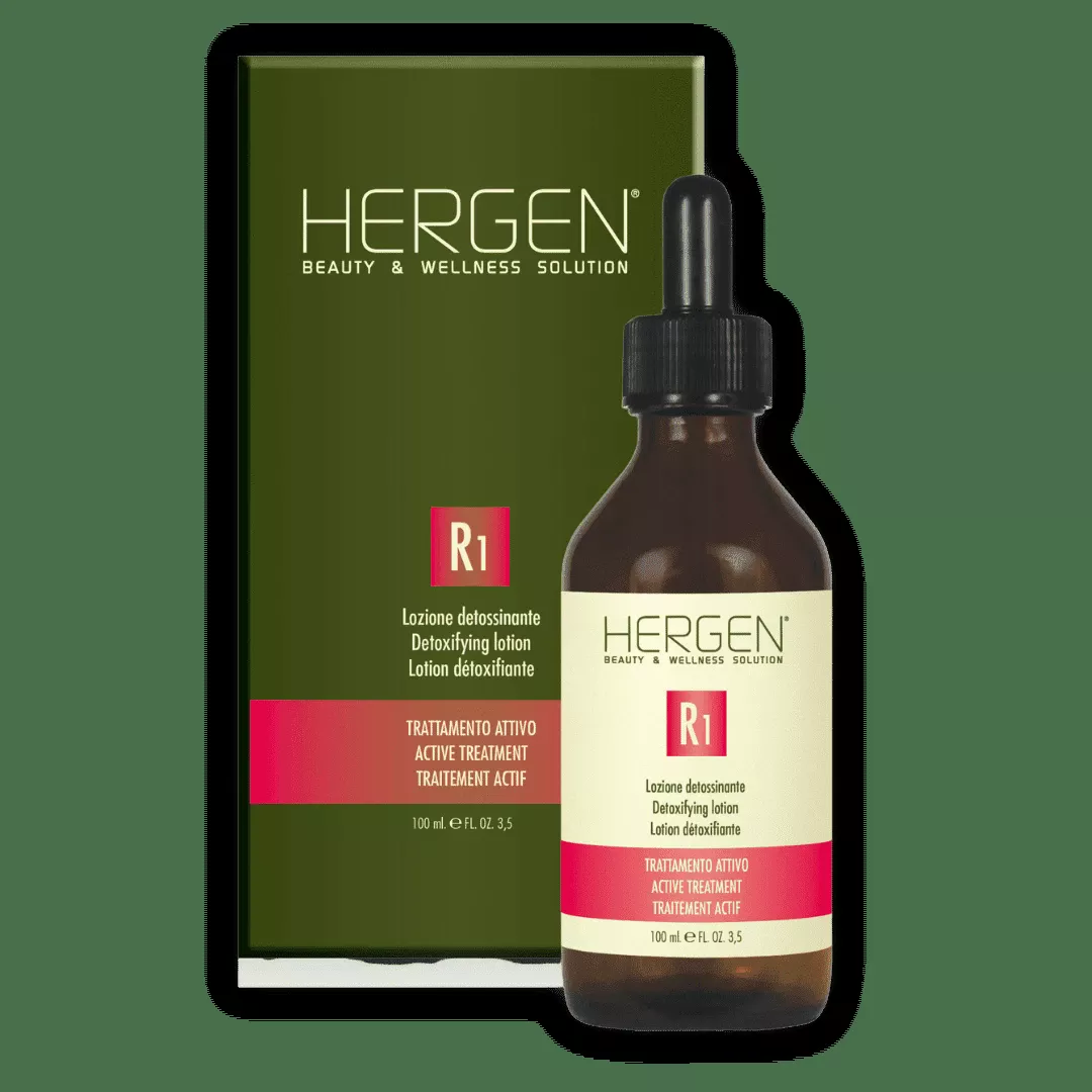 Brown glass bottle with dropper next to a green HERGEN R1 detoxifying lotion box on a white background.